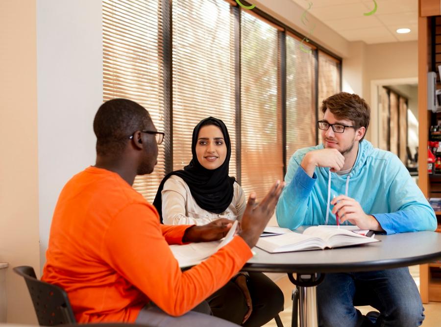 Students working together at the College of Business