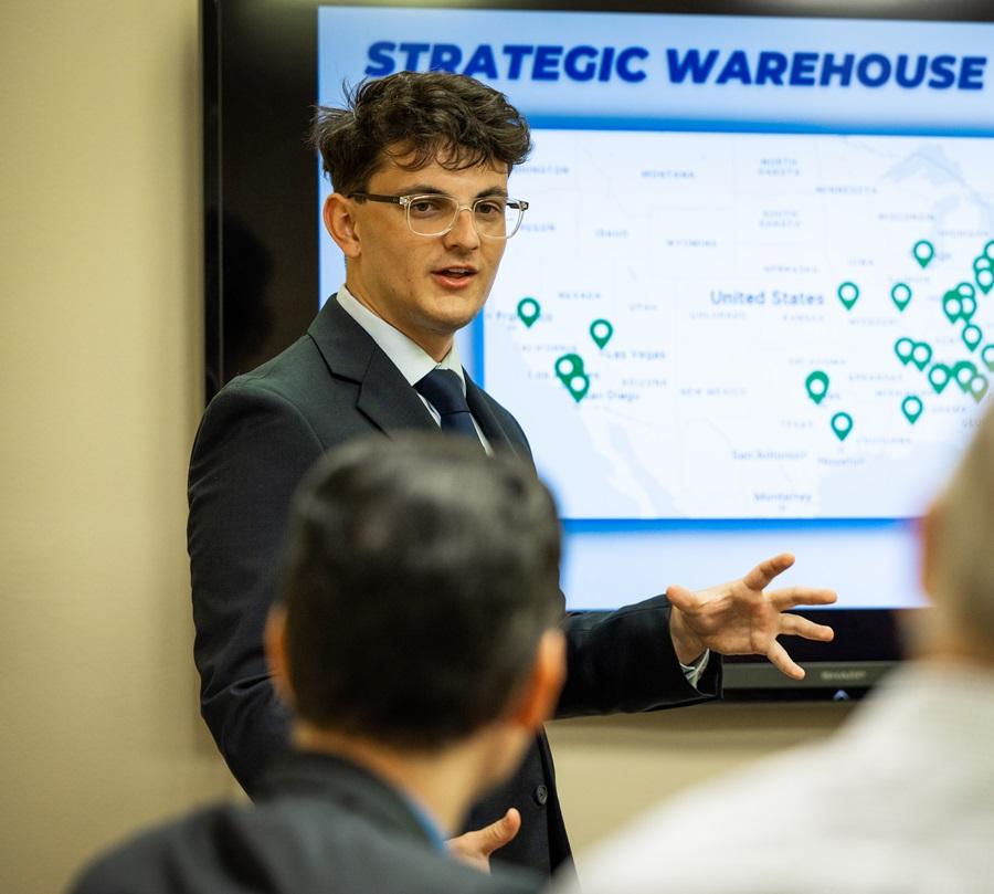 A student making a presentation to faculty