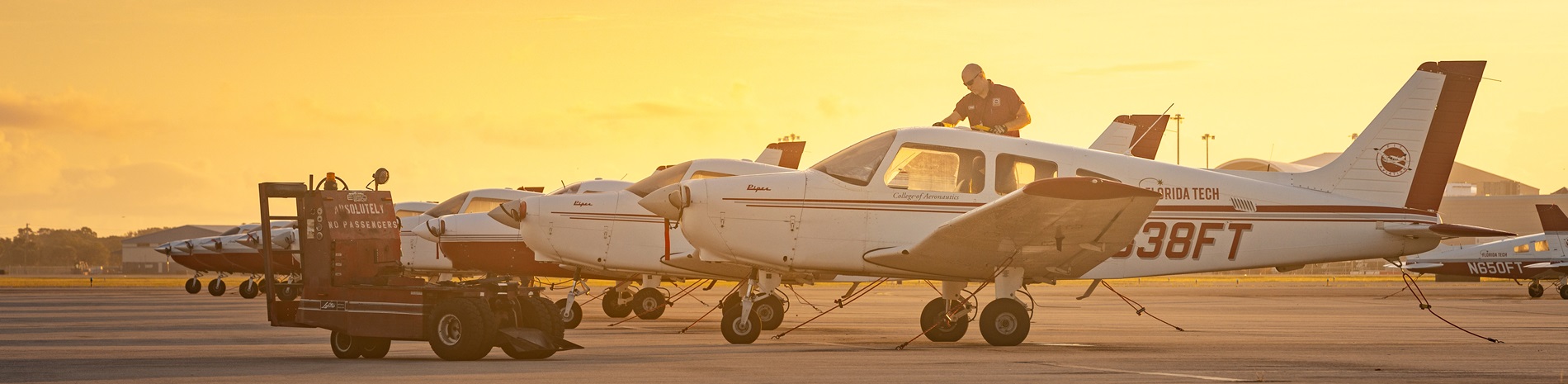 A man inspecting a plane in the Florida Tech fleet