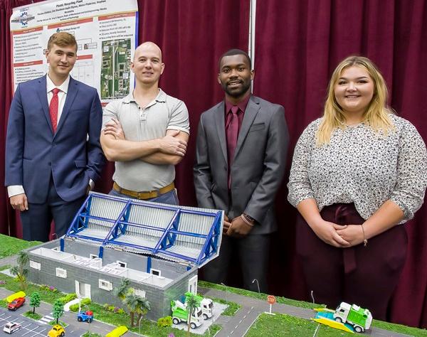 Students presenting their design for a plastic recycling plant