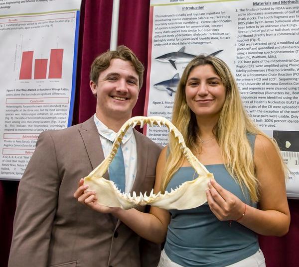 Students present their biology research at the Student Design Showcase.