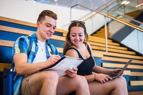 Two students reviewing notes