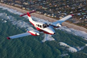 A Florida Tech airplane flying over the coast