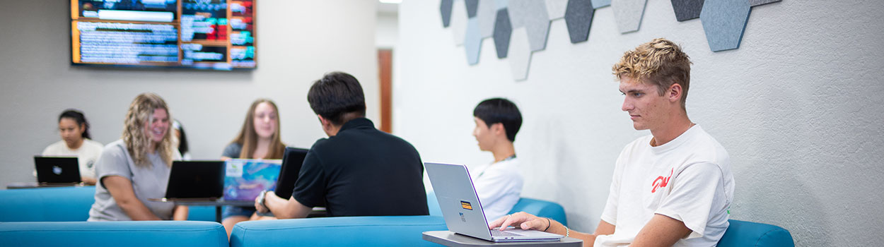 Students in the Bisk College of Business lobby