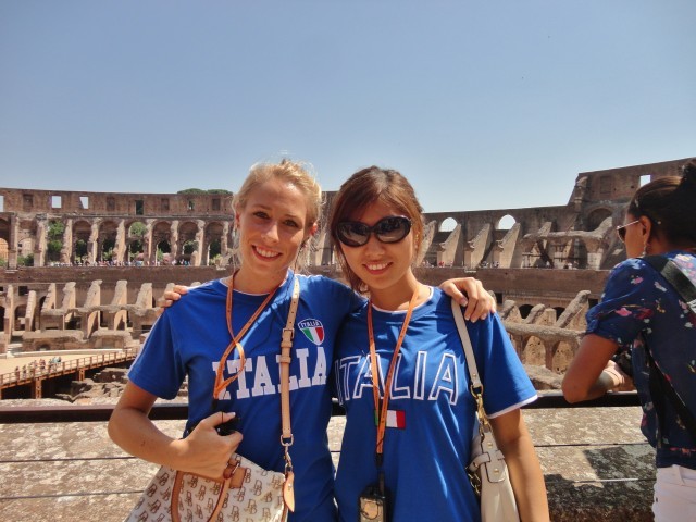 Two girls standing inside the Colosseum